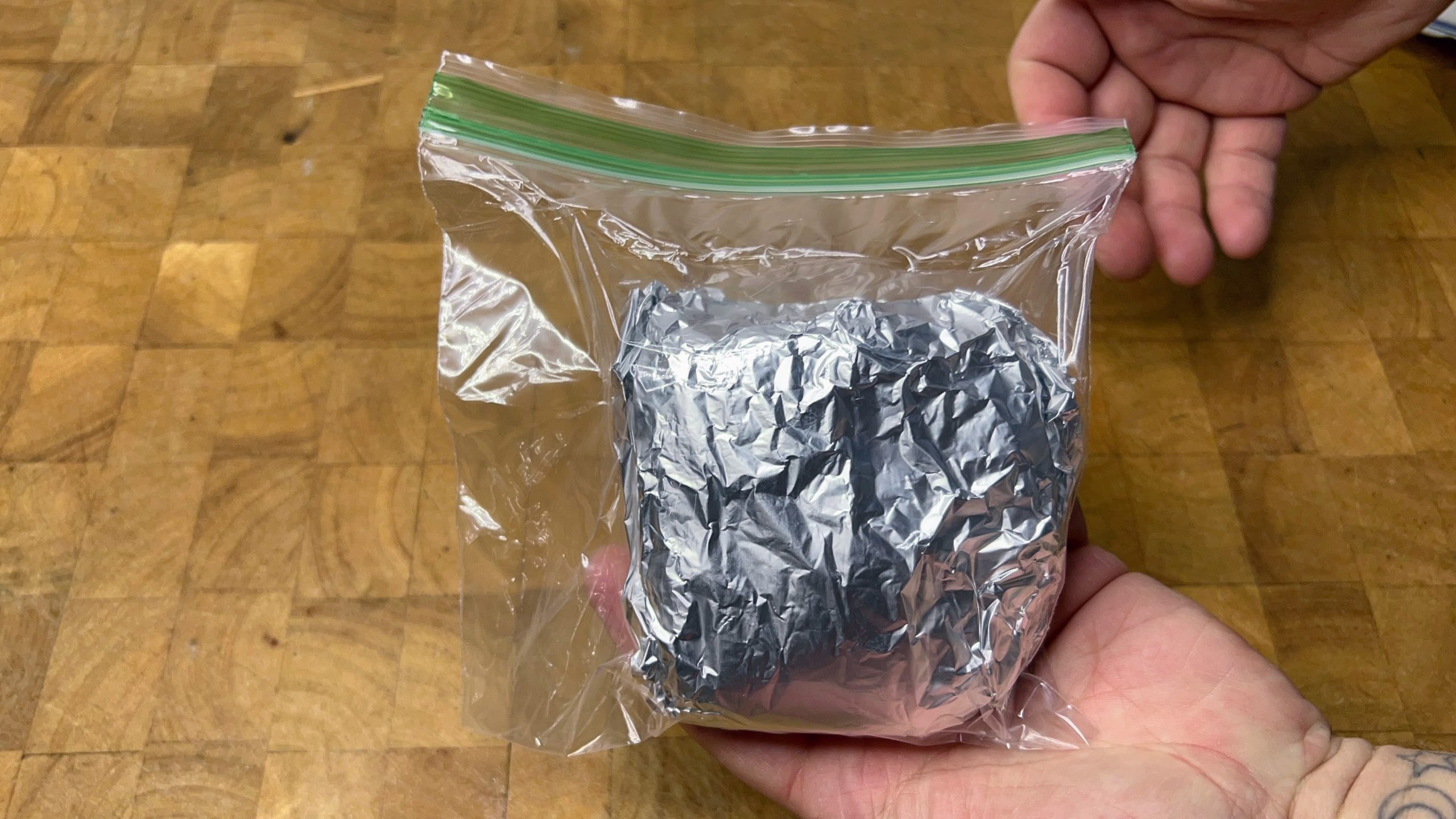 carrot cake wrapped in aluminum foil sealed in a freezer bag