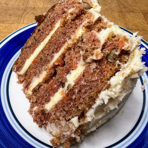 slice of carrot cake on blue and white plate