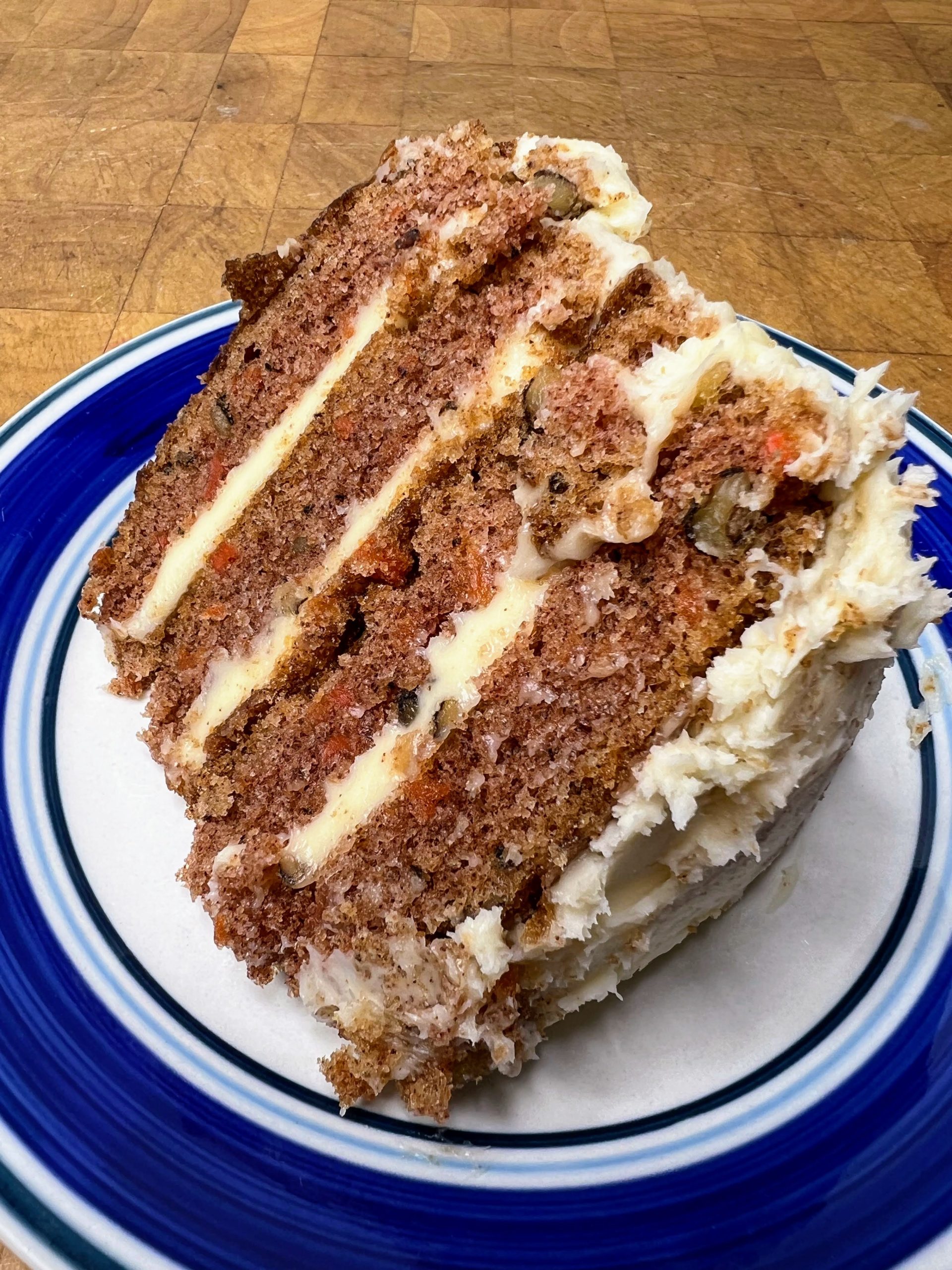 slice of carrot cake on blue and white plate