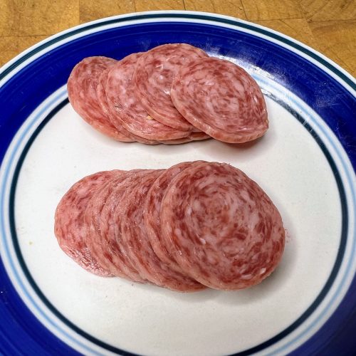plate with stacks of salami on it