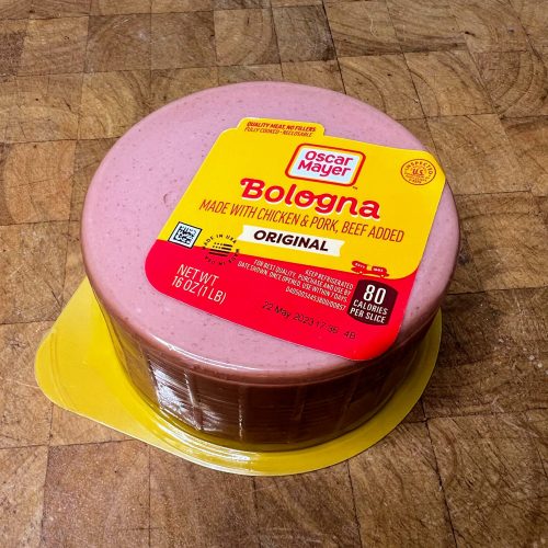 package of bologna on a wooden table