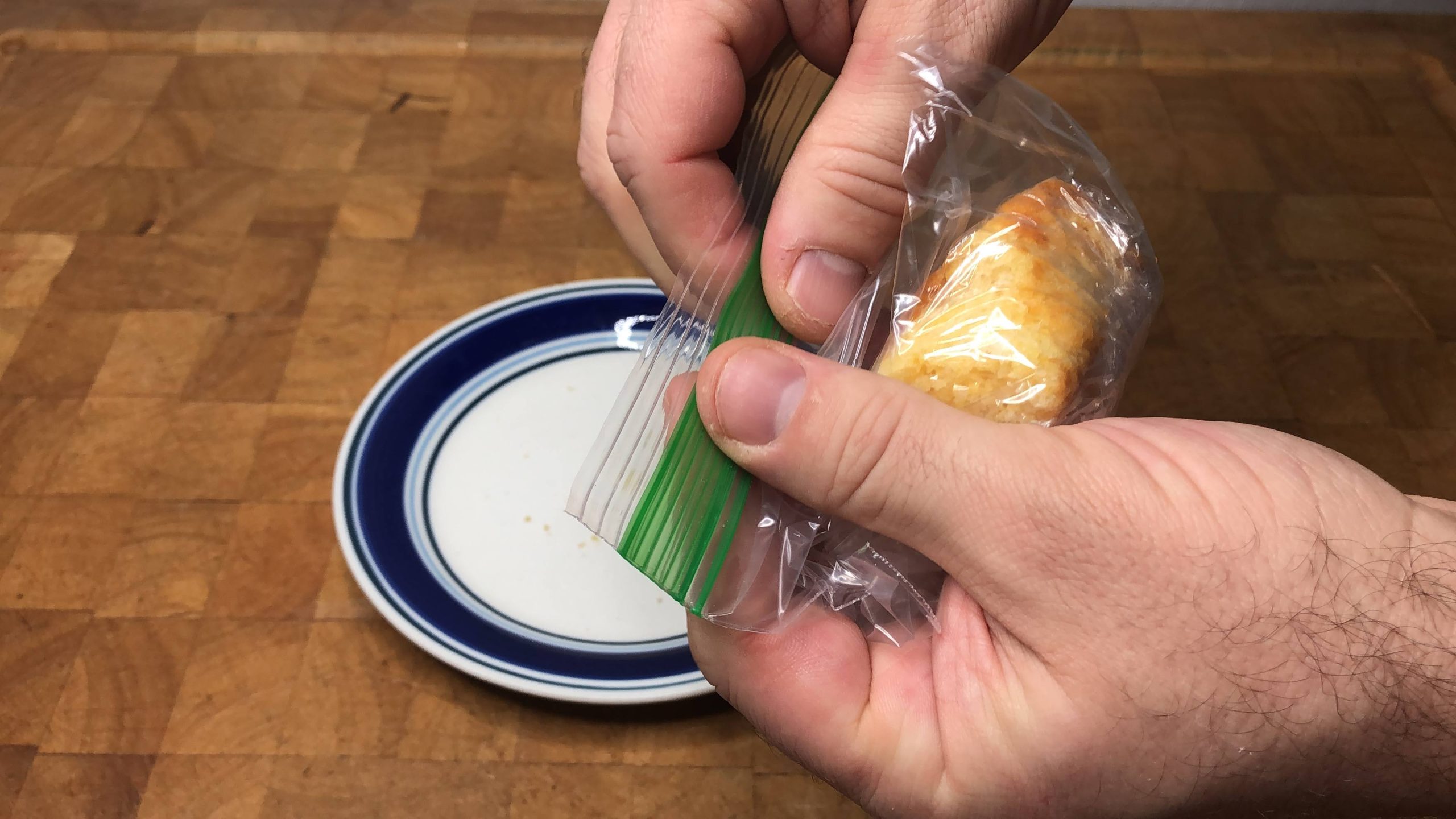 zipping a freezer bag filled with cornbread shut