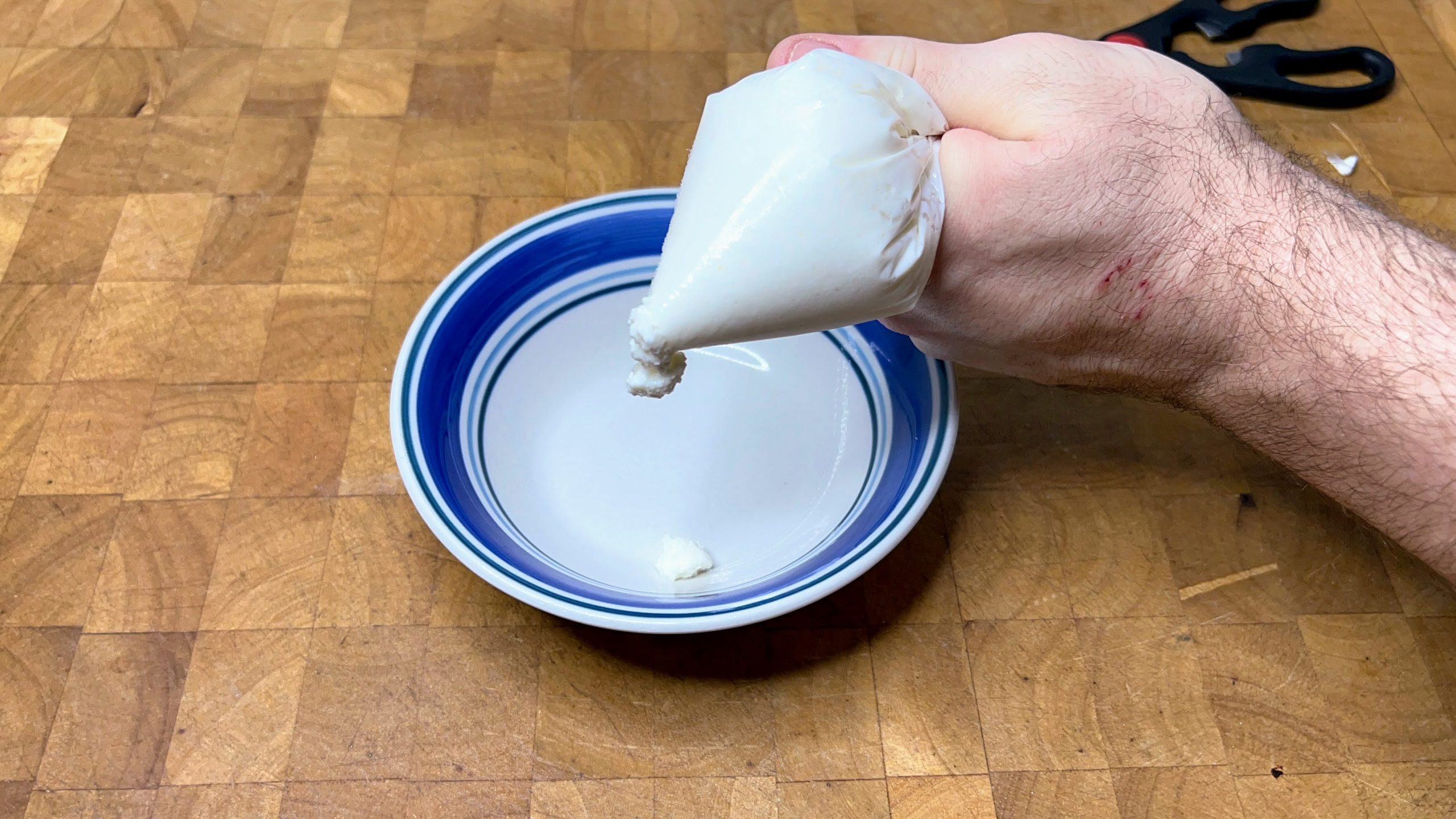squeezing cottage cheese out of a freezer bag
