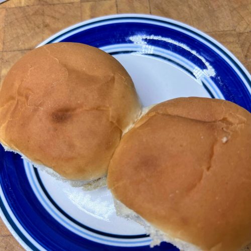 two hamburger buns on a plate