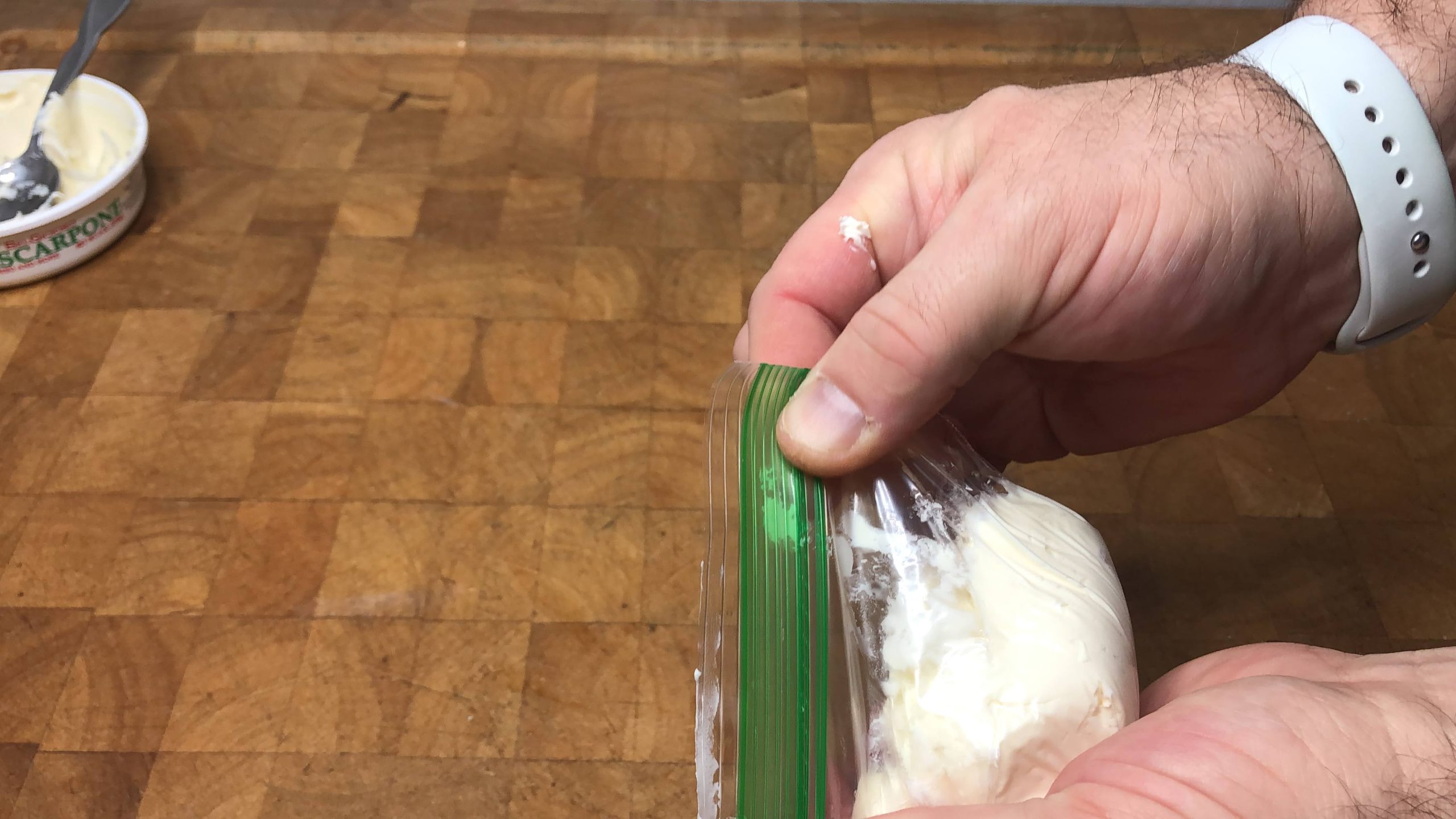 zipping freezer bag with mascarpone cheese in it shut