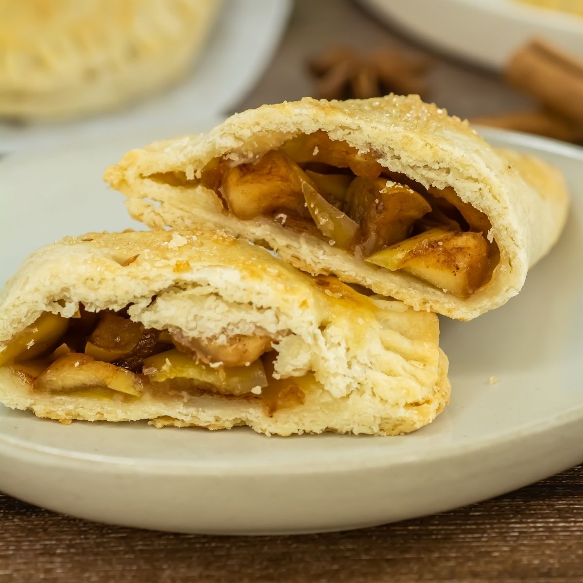 Apple empanadas on a plate.