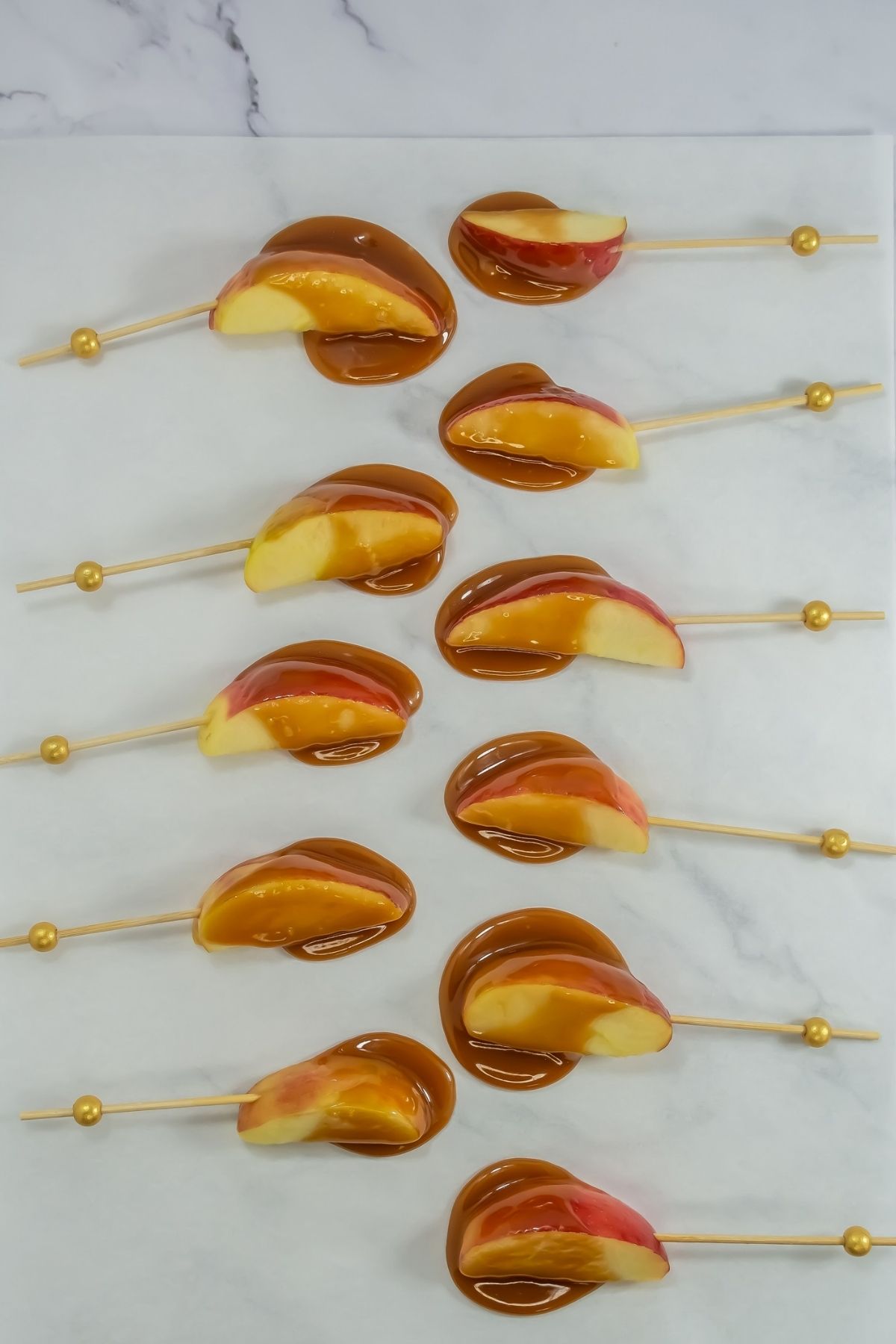 Slices apples drizzled with melted caramel.