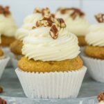 Carrot cake cupcakes on a plate.
