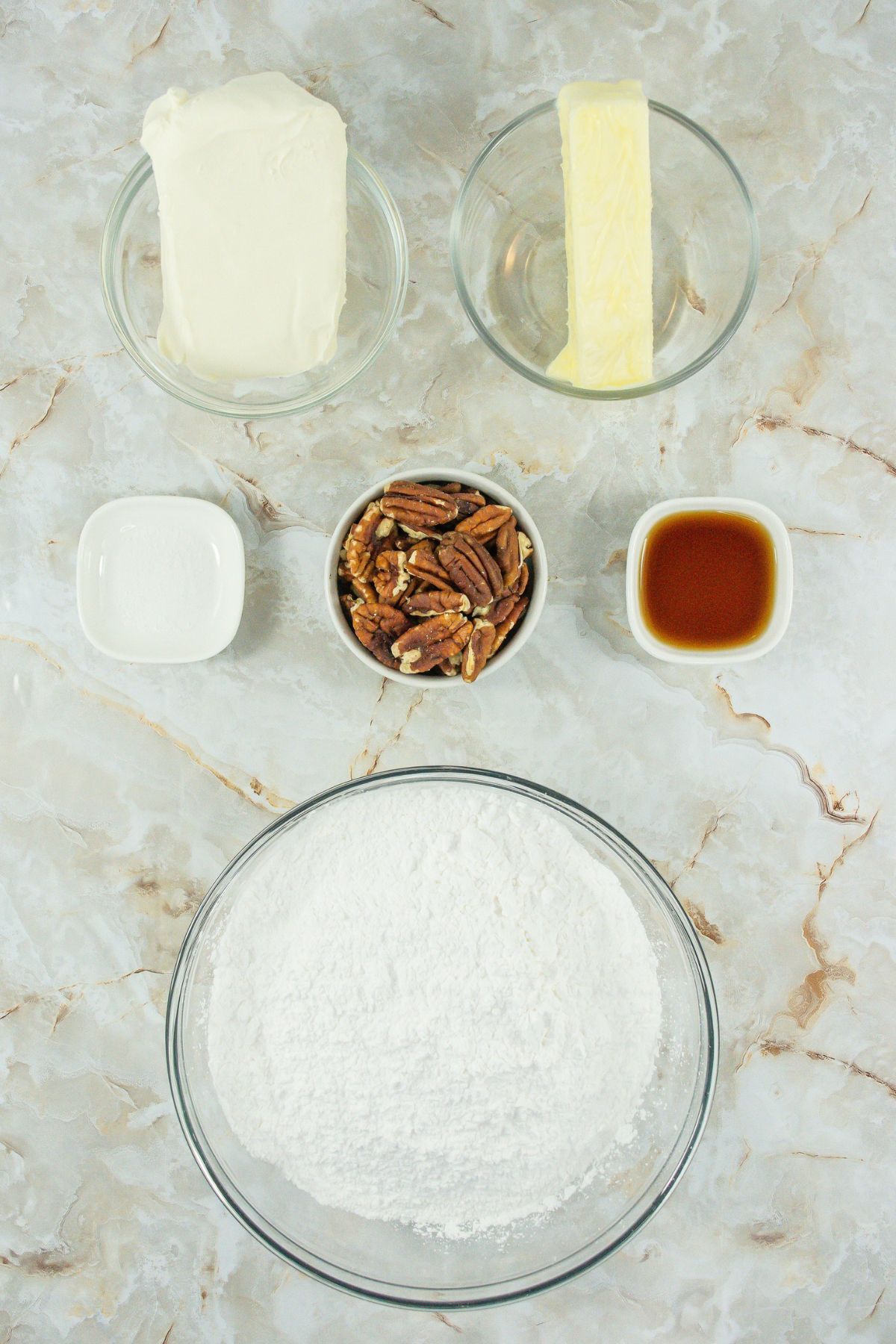 Cream cheese frosting ingredients on a counter.