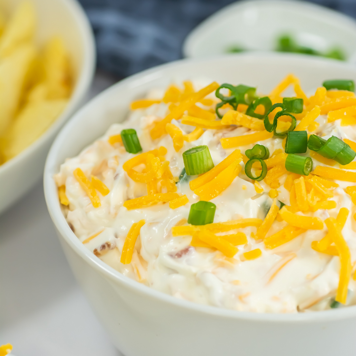Loaded baked potato dip in a bowl.