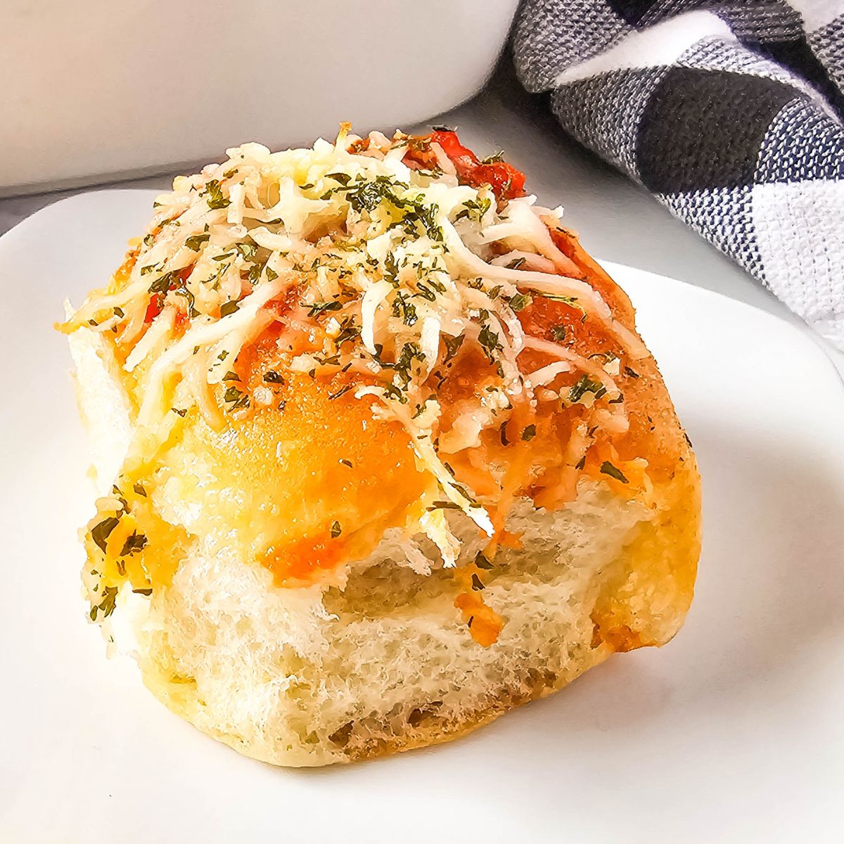 Meatball slider on a plate.