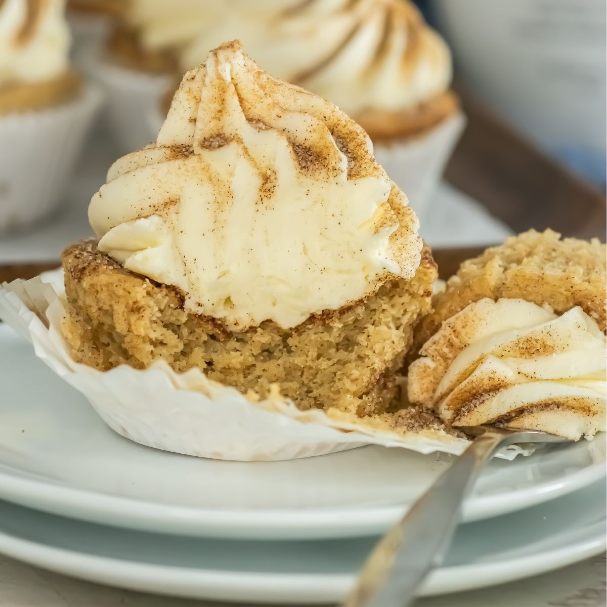 Rumchata cupcake cut in half on a plate.